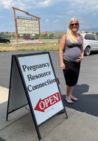 Pregnant mom outside of building